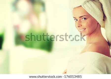 Portrait of 20-25 years old beautiful woman wearing bathrobe