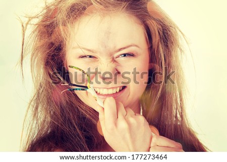 Young woman with wire - electric shock