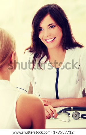 Female doctor with patient in office