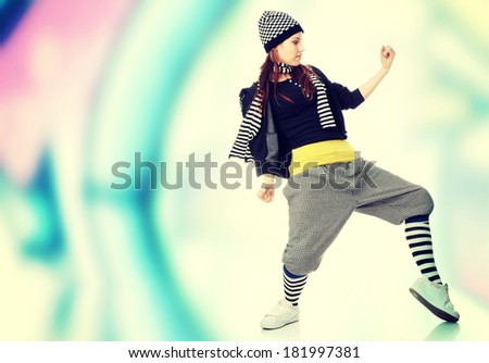 Young funky dancer against abstract grafitti background