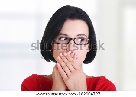 Shocked woman covering her mouth with hands