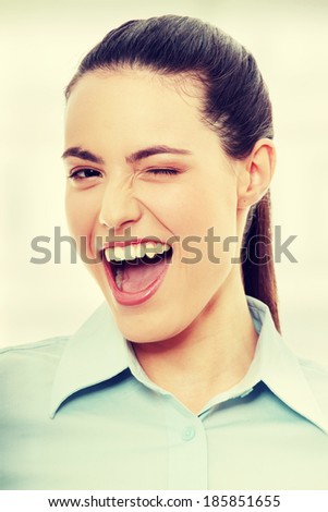 Businesswoman with big smile blinking.