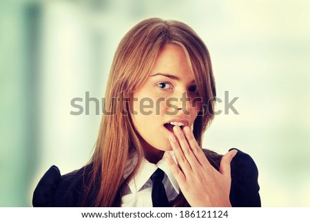 Shocked young caucasian business woman in office