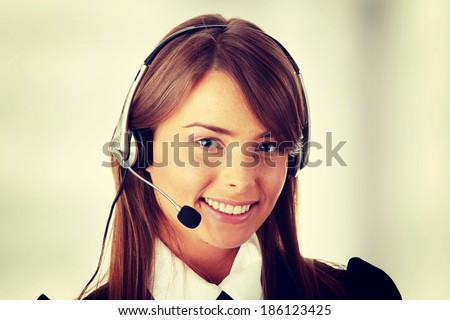 Beautiful Call Center Woman Wearing A Telephone Headset.