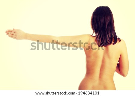 Nude beautiful female body from behind, with right arm up
