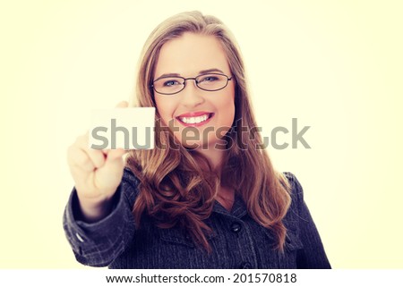 Businesswoman in suit holding blank empty business card