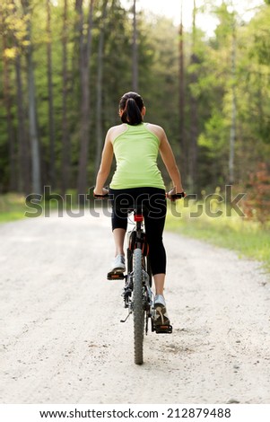 Female tourist with mountine bicycle