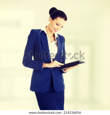 Attractive happy businesswoman, isolated on white