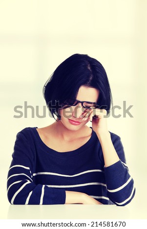 Young sad woman, have big problem or depression, over white background