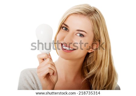 Green energy concept. Woman with led light bulb