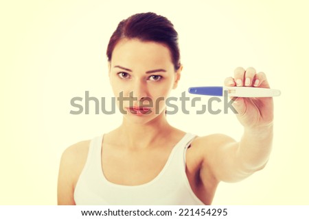 Woman worrying because of the pregnancy test result.