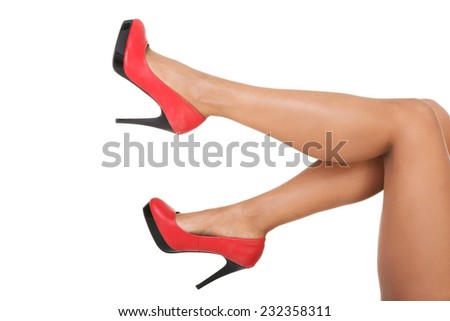 Side view of sexy female legs in high heels.