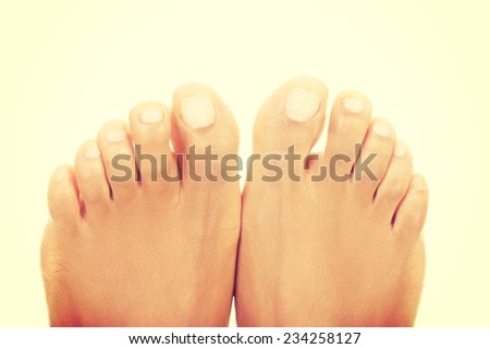 Beautiful female feet - close up on toes , isolated on white.