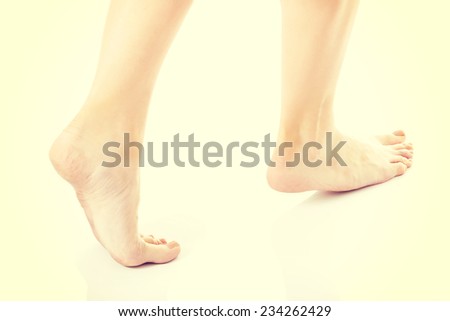 Woman\'s fresh clean feet with pedicure. Isolated on white.