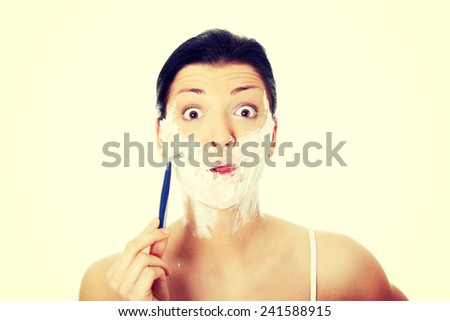 Young woman have morning shave.