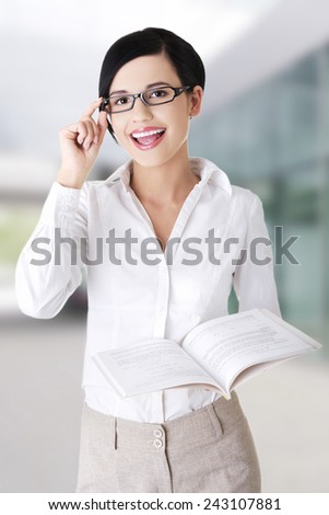 Young woman holding a book