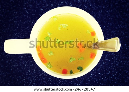 Hot vegetable soup in a cup.