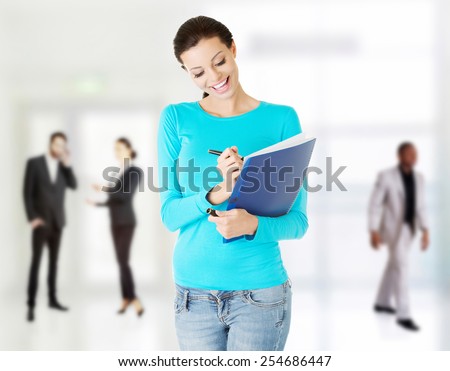 Student woman with note pad and pen