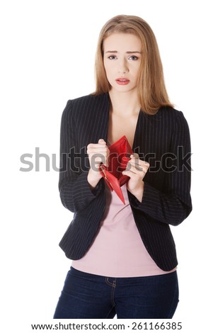 Worried woman showing her empty purse.