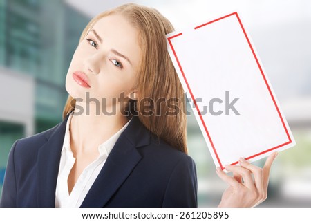 Beautifull caucasian business woman is holding empty white board. Isolated on white.
