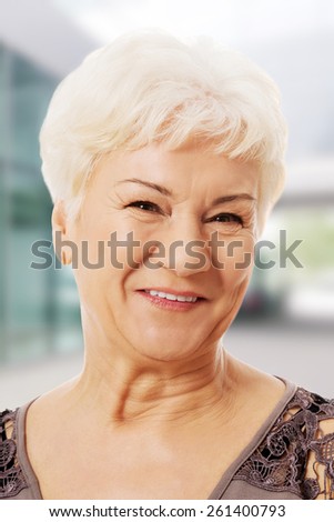 Portrait of an old, smiling woman