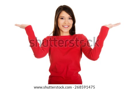 Beautiful woman making a scale with her arms wide open.