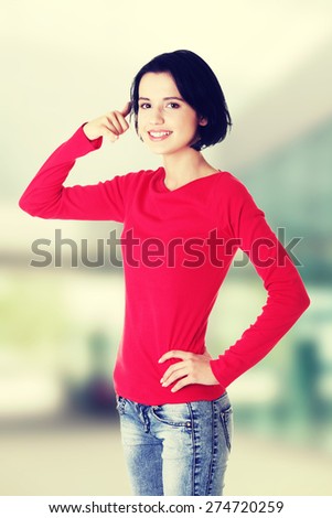 Young happy woman gesturing \
