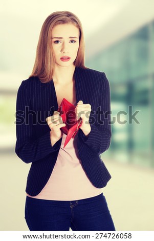 Sad woman with empty purse