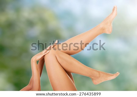 Beautiful female legs up after depilation.