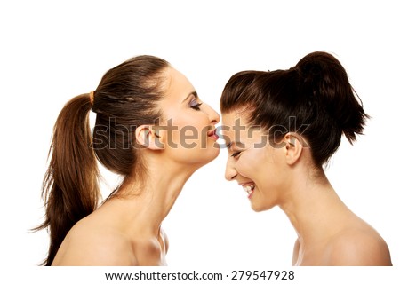 Beautiful woman kissing her friend in forehead.