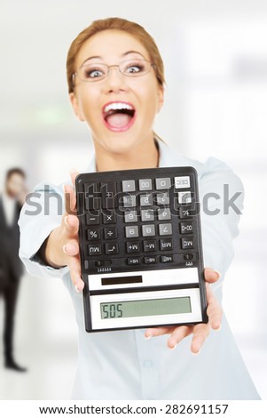 Fear woman with sos on calculator.