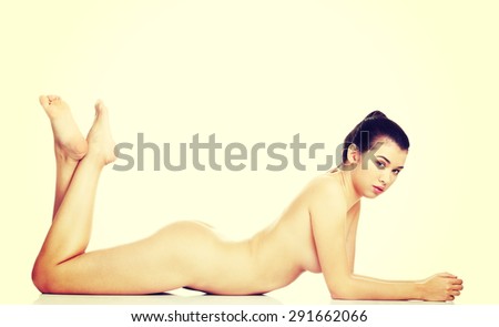 Slim naked woman lying down