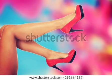 Woman slim nude legs in heels