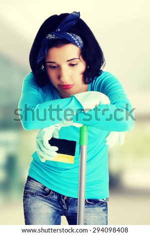 Tired and exhausted cleaning woman