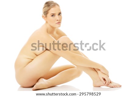 Young nude woman sitting down on a… Stock Photo 104120006 - Avopix.com