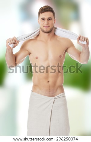 Well build handsome man with a towel around neck.