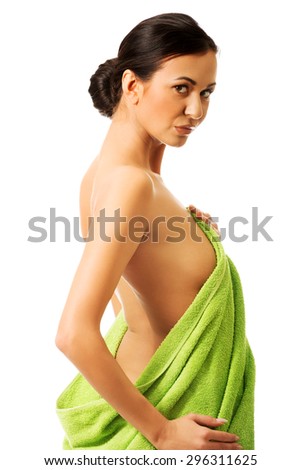 Woman wrapped in towel back to the camera.