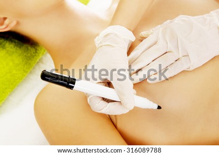 Young woman before plastic surgery lying on table.