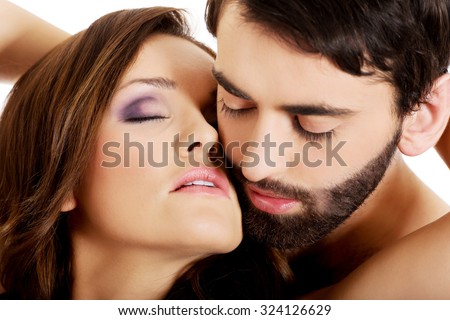 Sexy passionate heterosexual couple embracing.