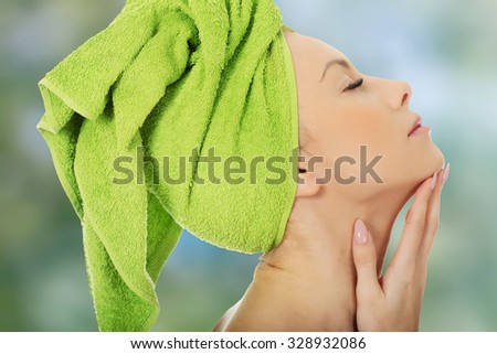 Sensual woman with towel wrapped on head.