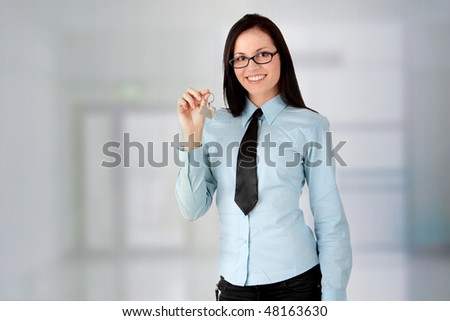 Young businesswoman  (real estate agent) in office