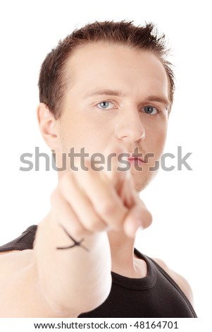 Young caucasian man, pointing at camera. Isolated on white