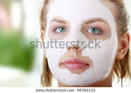 Cosmetics mask of clay on the  young female face