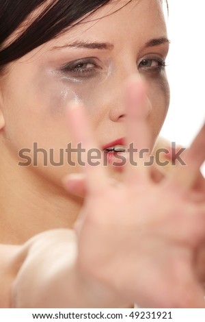 Abused woman crying over white background