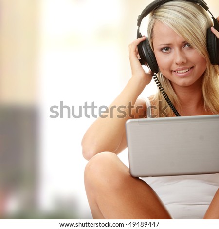 Casual student listening to music on the computer while studying