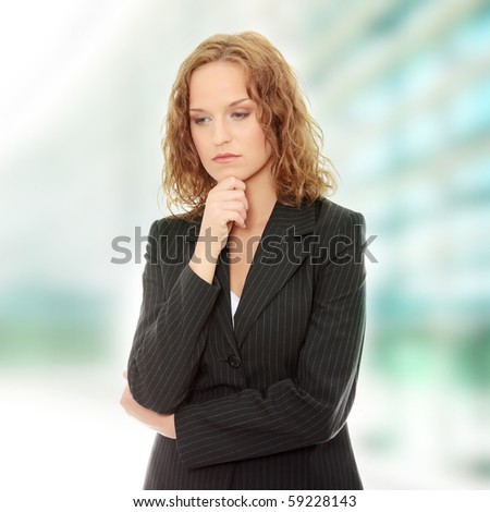 Young businesswoman thinking