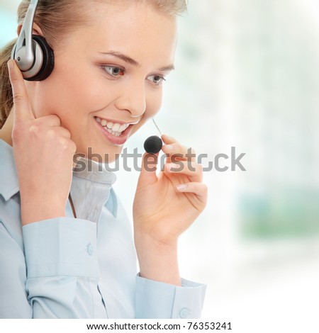 Call center woman with headset. Beautiful smiling caucasian woman