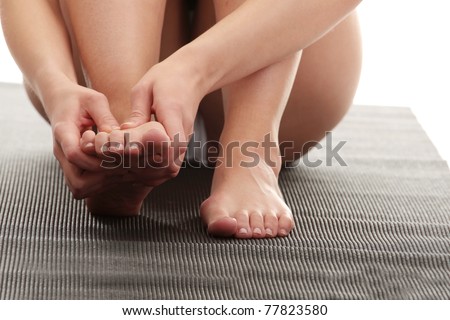 Woman touching her leg - pain concept