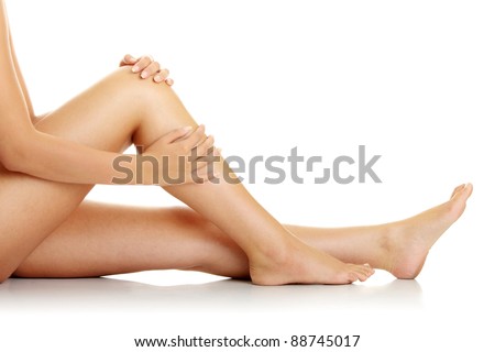 Knee Injury. Woman holding on sore knee.