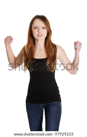 A frustrated and angry woman with fists up